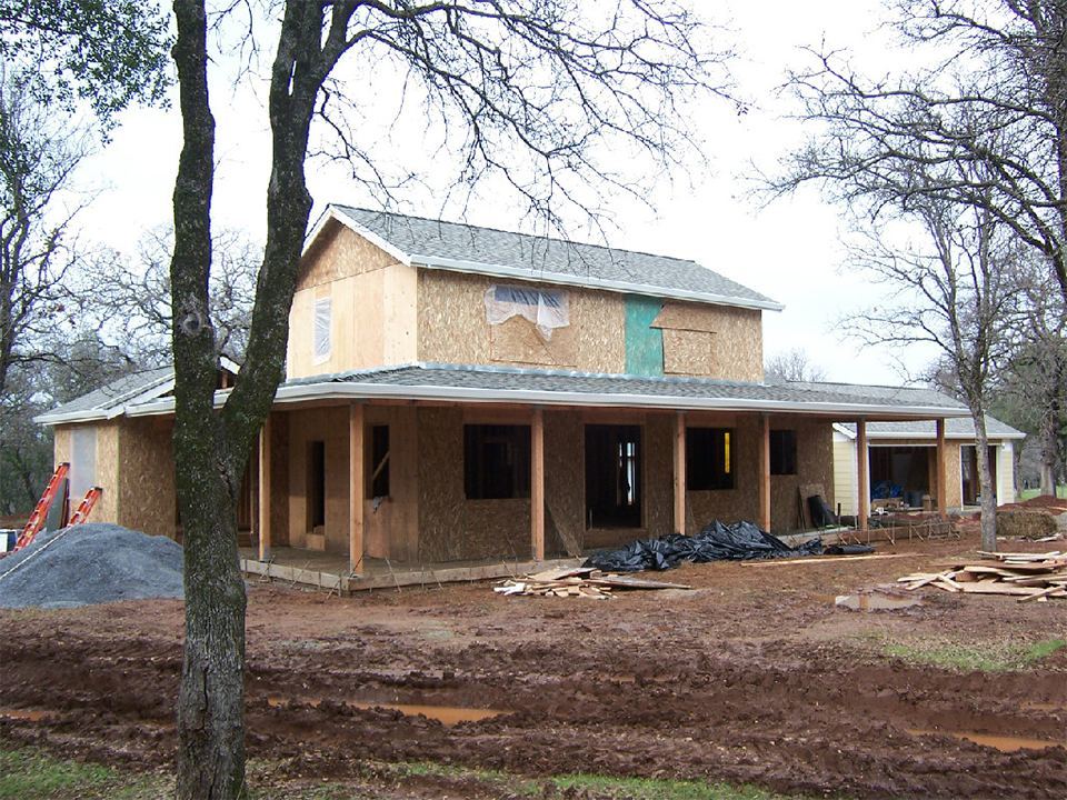 New two-story home under construction with its new roof installed