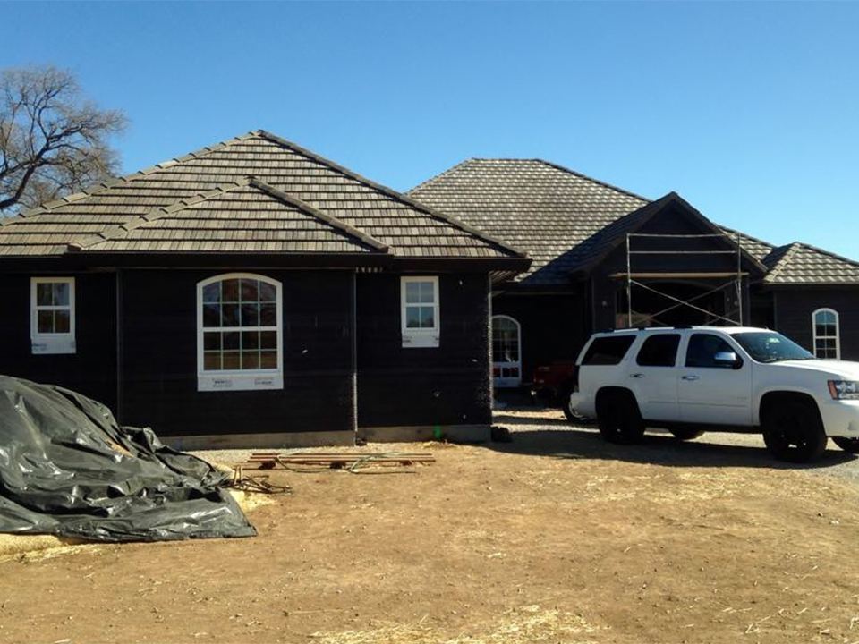 Large home with a newly completed hip roof in Northern California