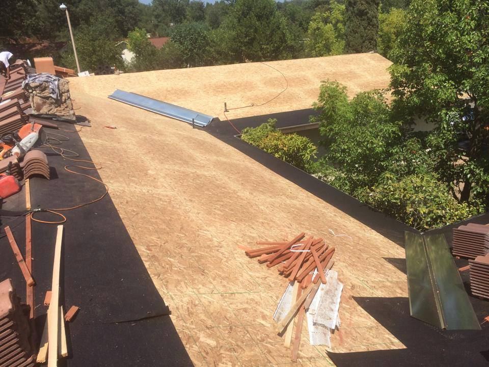 New roof decking installed and ready for underlayment and tile