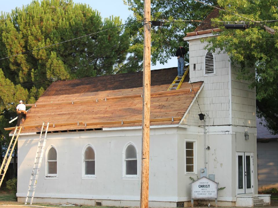 Historic church reroof in progress with the old roofing stripped back